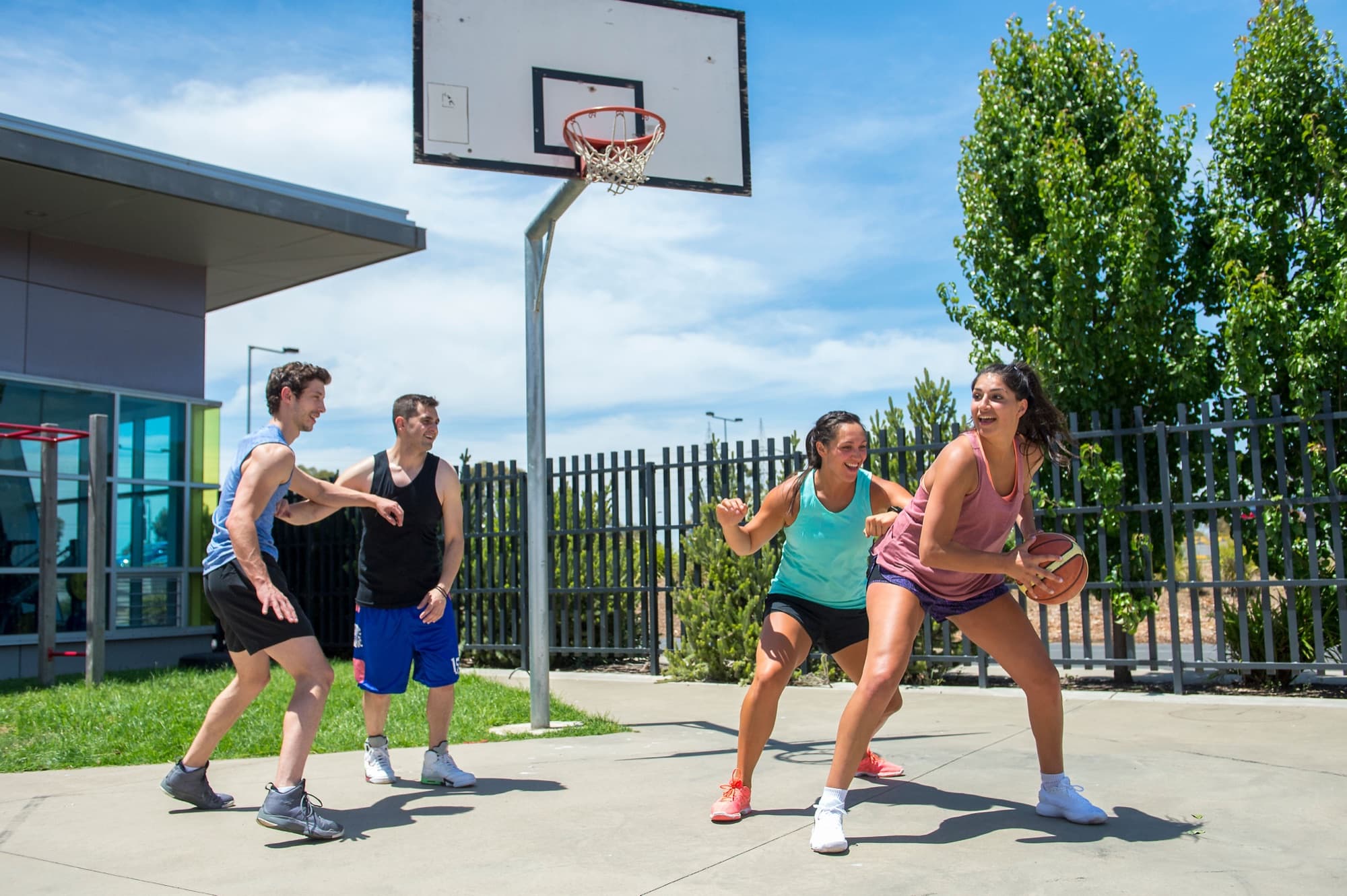 Group playing a social basketball game